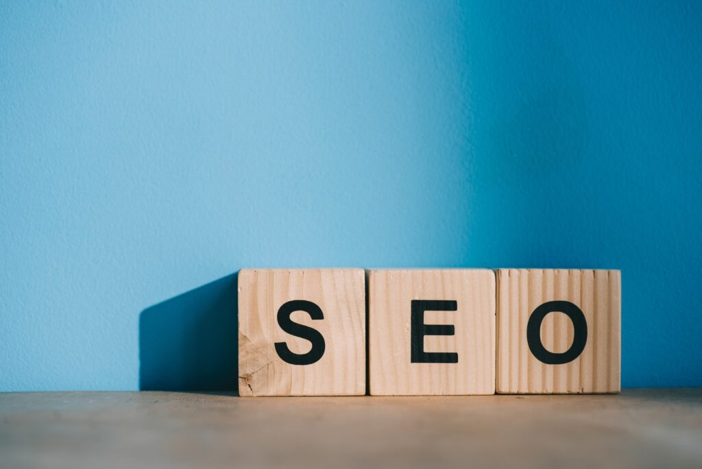 alphabet blocks with SEO word on blue background