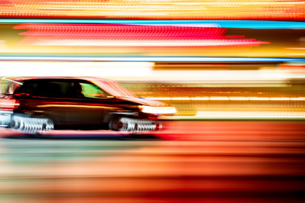 Colorful minimalism -- abstract concept automotive car in motion with lights and blur